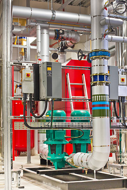 Industrial boiler plant room with pipework and gauges
